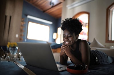 Woman_On_Laptop_Laying_Down