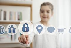 Little girl touching the security button on the digital screen - stock photo